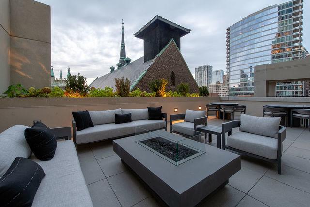 view of patio / terrace featuring an outdoor living space with a fire pit