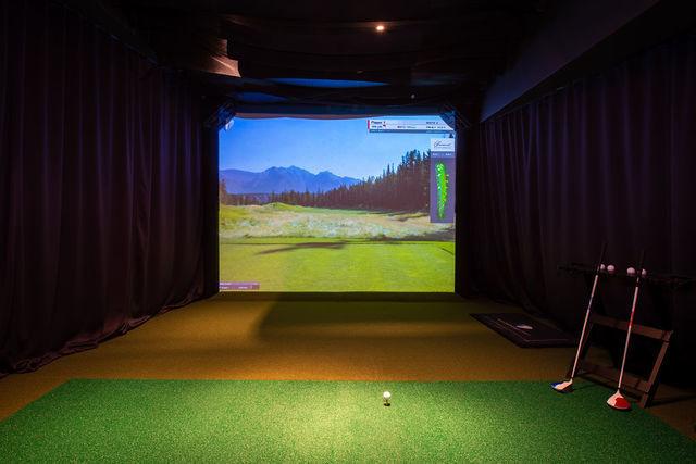 playroom with golf simulator and a mountain view