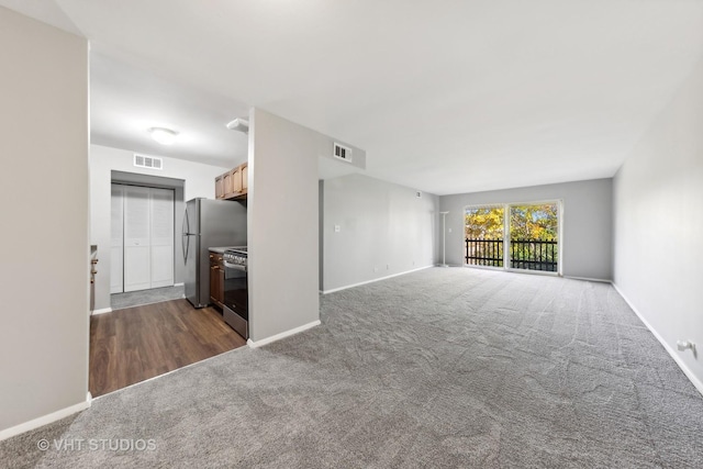 unfurnished living room with carpet