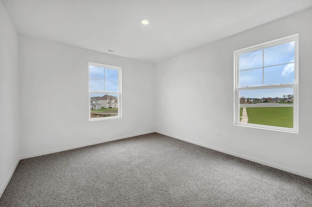 empty room featuring carpet floors