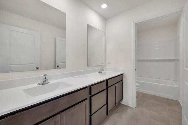 full bathroom featuring vanity, toilet, and shower / bath combination