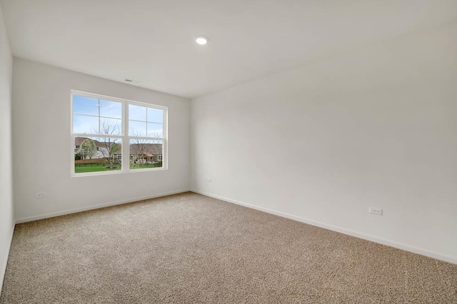 spare room featuring carpet flooring