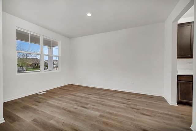 spare room featuring light hardwood / wood-style flooring