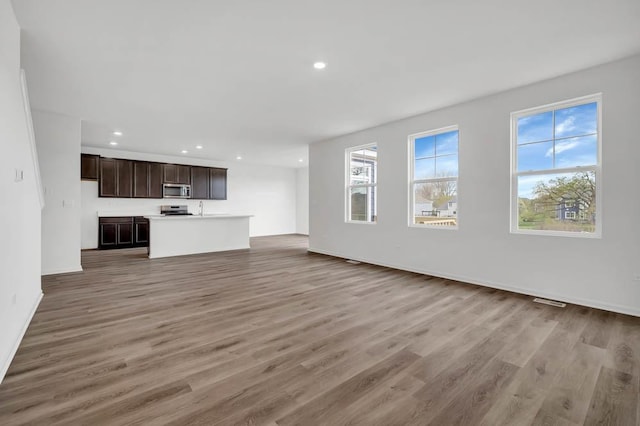 unfurnished living room with light hardwood / wood-style floors