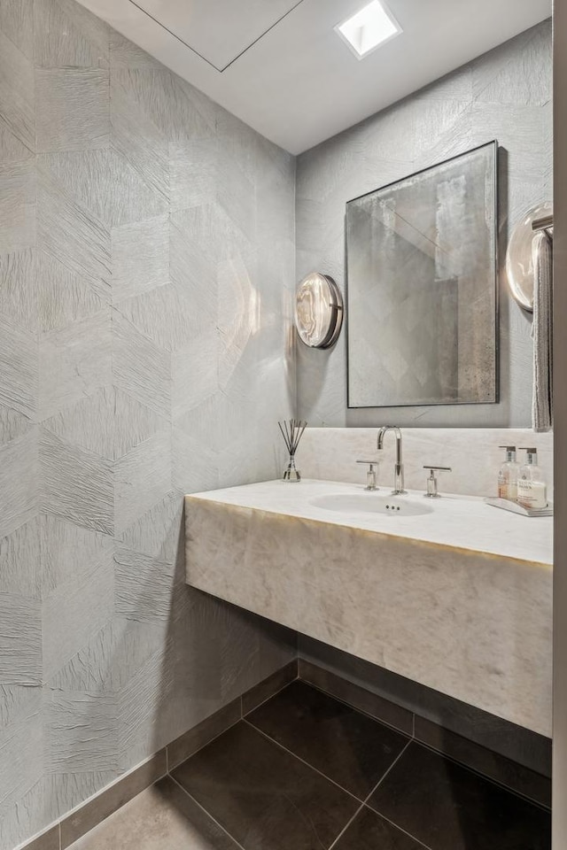 bathroom with sink and tile patterned floors