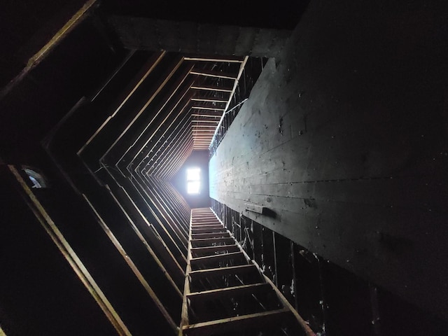 staircase featuring vaulted ceiling