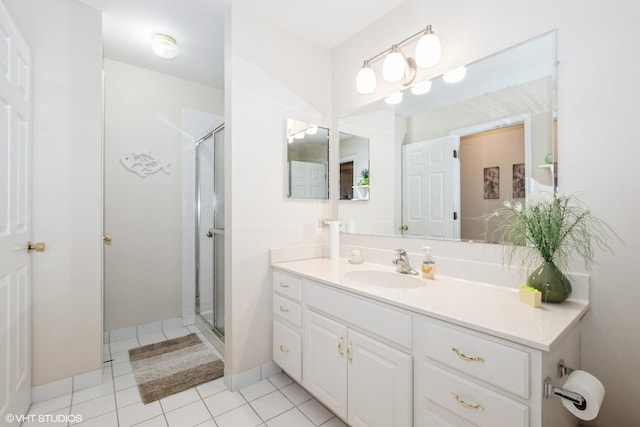 bathroom featuring tile patterned floors, vanity, and an enclosed shower