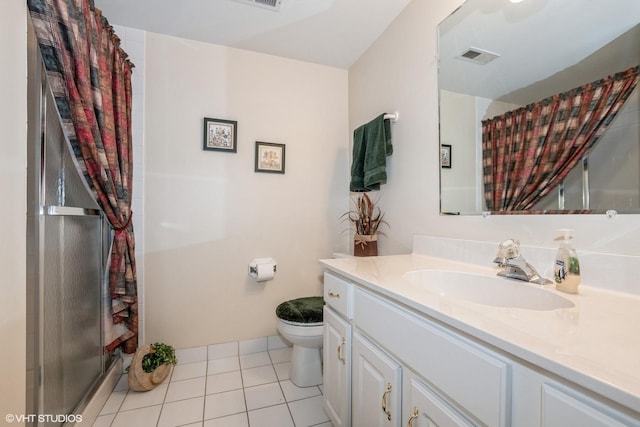 bathroom with tile patterned flooring, vanity, a shower with curtain, and toilet