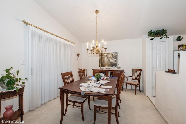 carpeted dining room with vaulted ceiling and an inviting chandelier