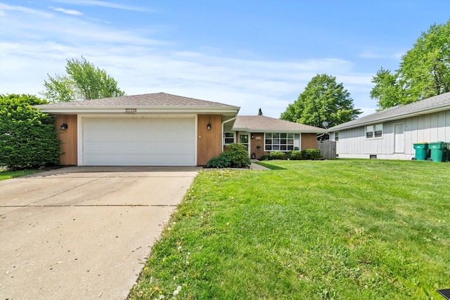single story home with a garage, driveway, and a front yard