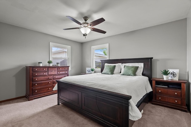 bedroom featuring carpet flooring, a ceiling fan, and baseboards