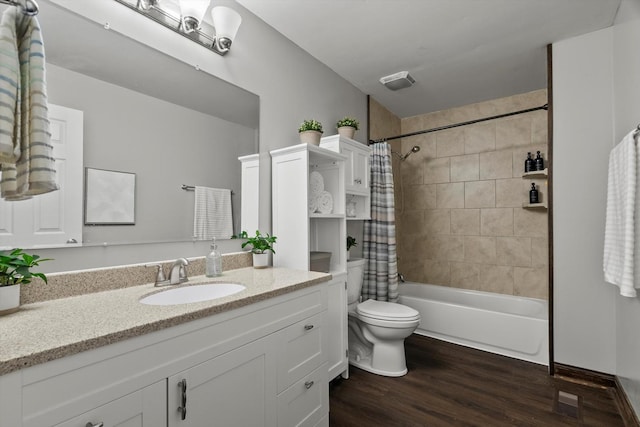 full bath with wood finished floors, toilet, shower / tub combo with curtain, and vanity