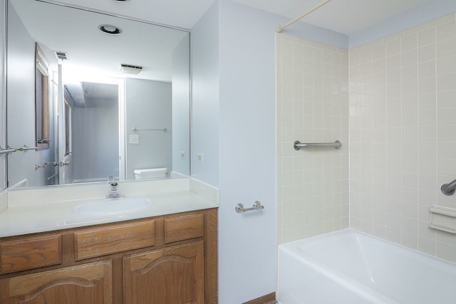 full bathroom featuring shower / bathtub combination, vanity, and toilet