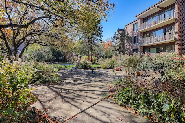 view of property's community with a patio