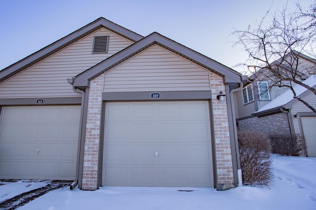 view of snow covered garage