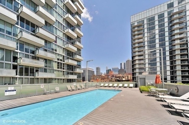 view of swimming pool featuring a patio area