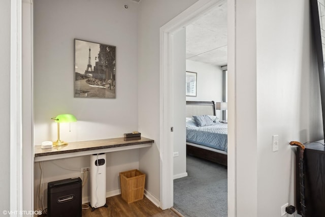 hallway featuring dark hardwood / wood-style floors