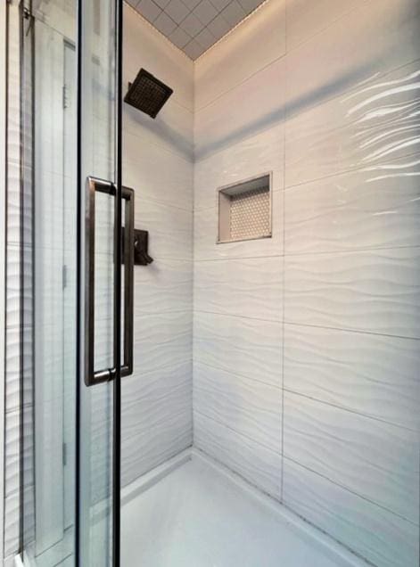 full bath featuring a shower stall