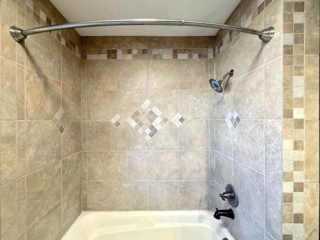 bathroom with shower / bathtub combination