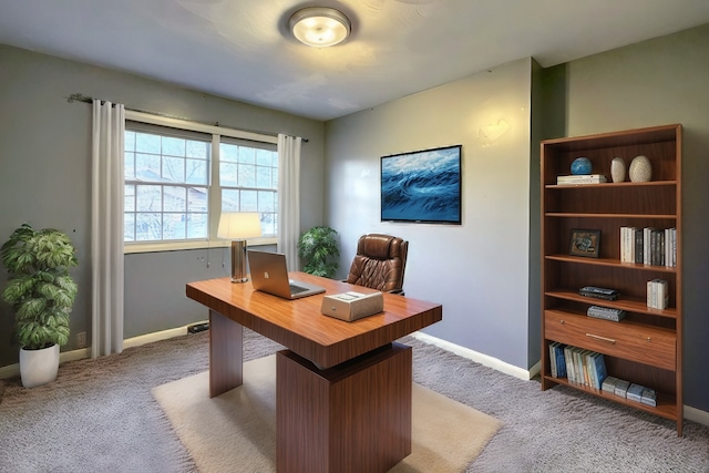 home office with baseboards and carpet