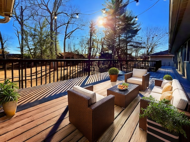 wooden terrace featuring an outdoor living space