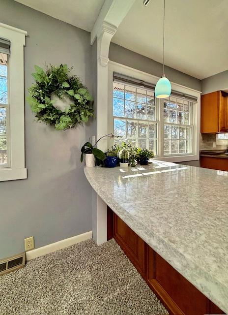 interior space with visible vents and baseboards