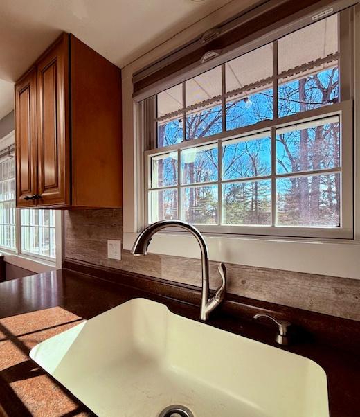 interior details with brown cabinetry and a sink