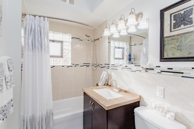 full bathroom with toilet, shower / tub combo, tile walls, vanity, and decorative backsplash