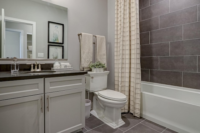 full bathroom featuring tile patterned flooring, vanity, shower / tub combo with curtain, and toilet