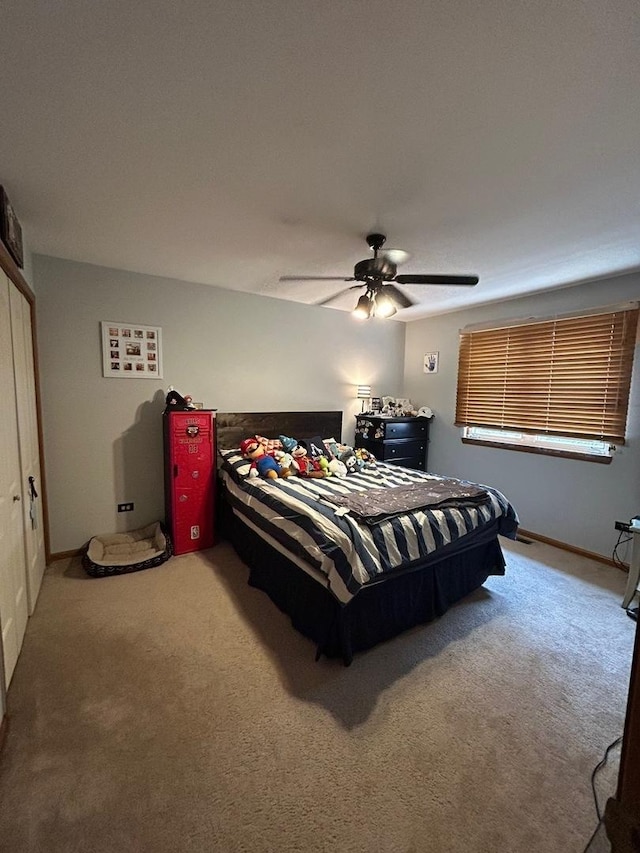 bedroom featuring ceiling fan and carpet flooring