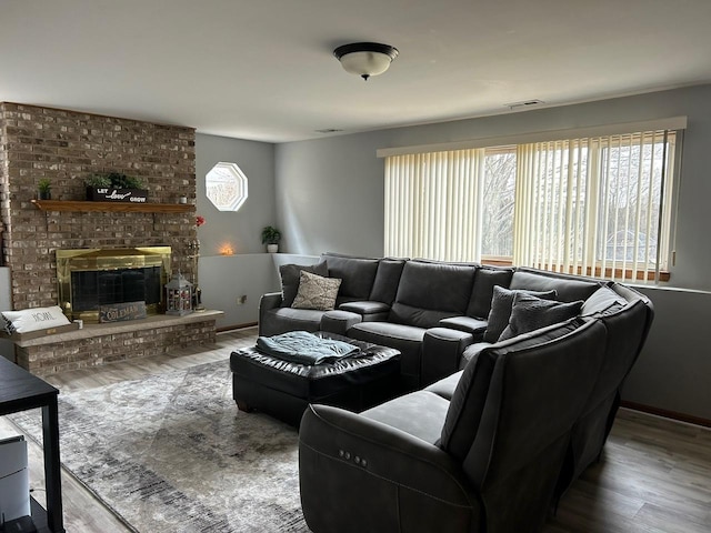 living room featuring hardwood / wood-style floors and a wealth of natural light