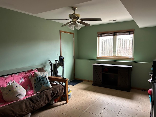 bedroom featuring ceiling fan and light tile patterned flooring