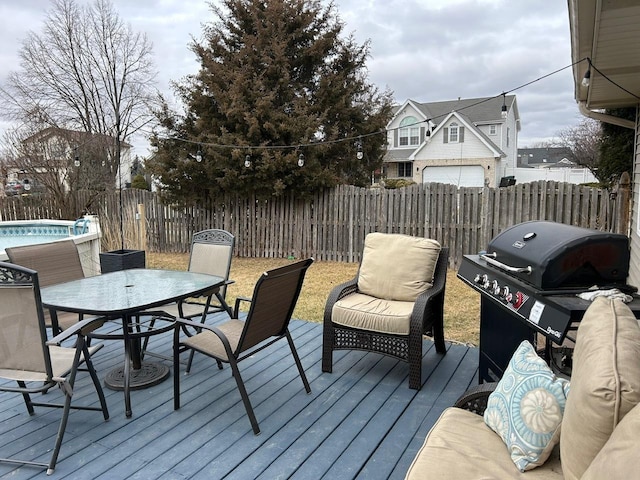 wooden terrace featuring grilling area