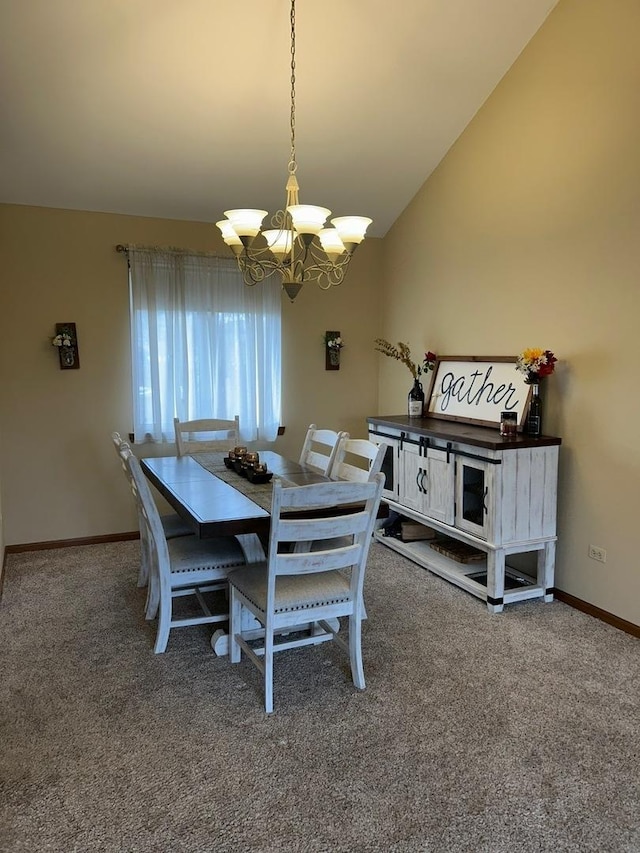 dining area featuring lofted ceiling, an inviting chandelier, and carpet flooring