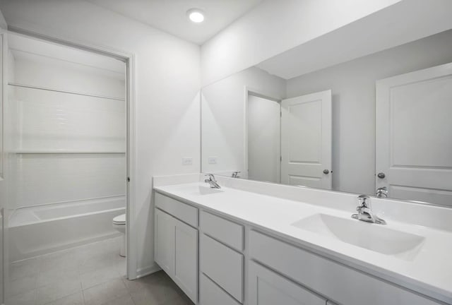 full bathroom featuring vanity, tile patterned floors,  shower combination, and toilet