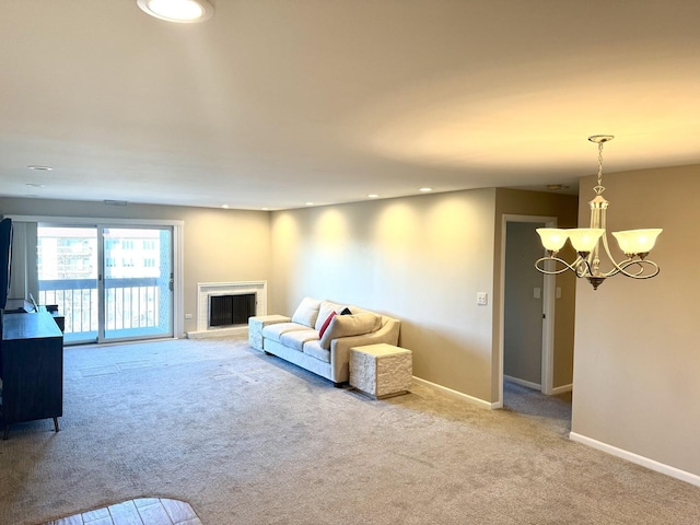 living room featuring light colored carpet and a notable chandelier