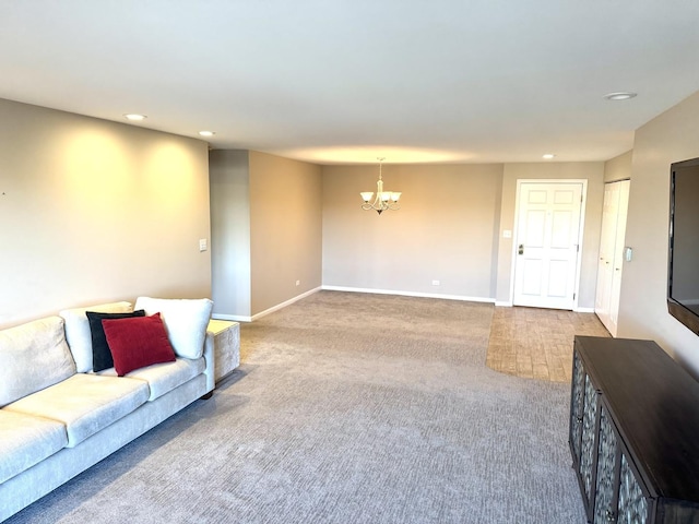 living room with a notable chandelier and carpet floors