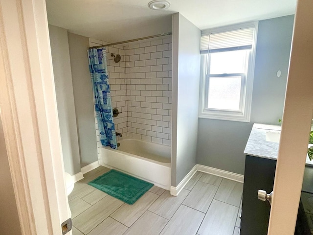 bathroom featuring vanity and shower / bath combo with shower curtain