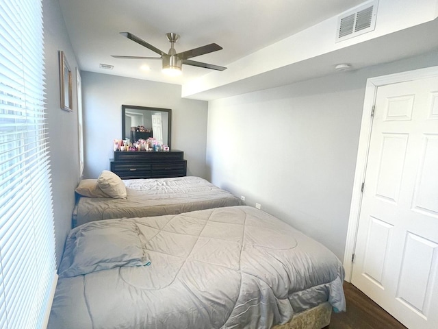 bedroom featuring ceiling fan and dark hardwood / wood-style flooring