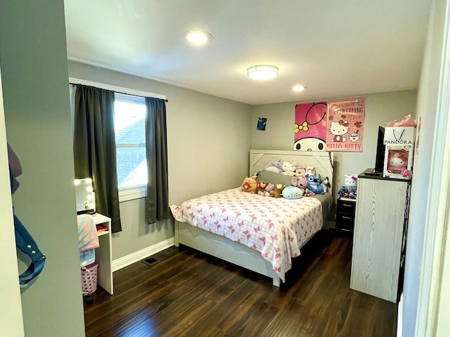 bedroom featuring dark wood-type flooring