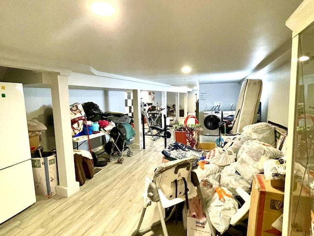 interior space featuring white fridge and light hardwood / wood-style flooring