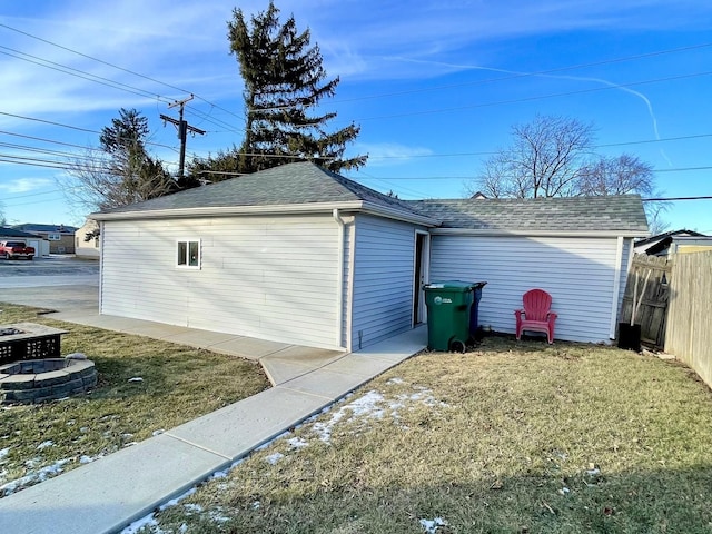 garage featuring a lawn