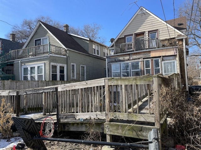 rear view of house featuring a balcony