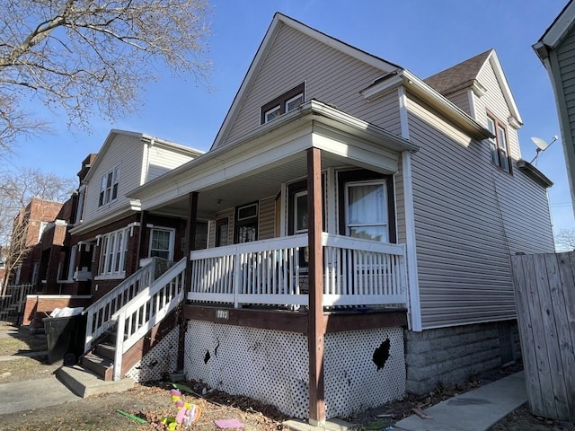 view of side of property with a porch