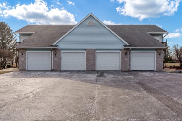 single story home featuring a garage