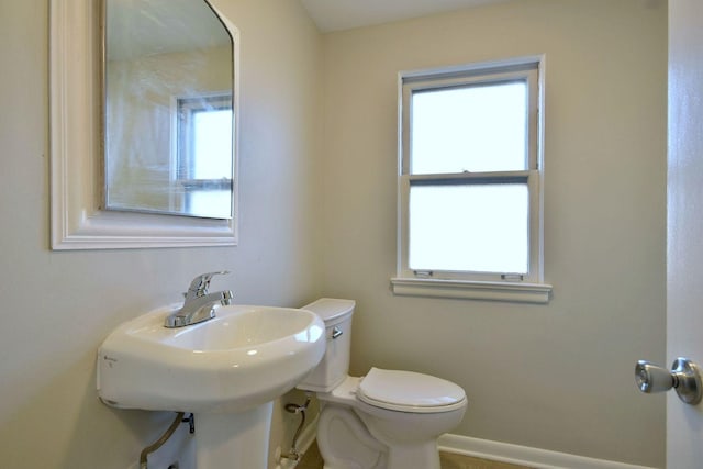 bathroom featuring toilet and sink