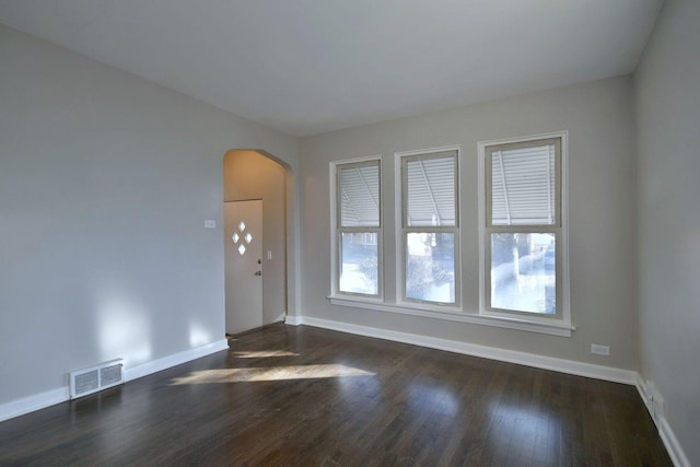 unfurnished room featuring dark hardwood / wood-style floors