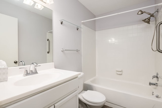 bathroom with toilet, vanity, and shower / tub combination