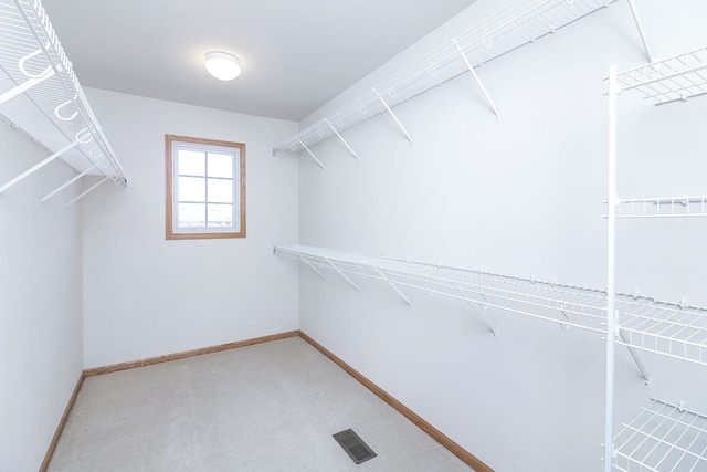 walk in closet with carpet floors and visible vents