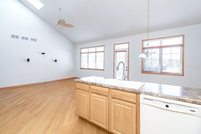 kitchen with light wood finished floors, visible vents, light brown cabinets, white dishwasher, and a sink